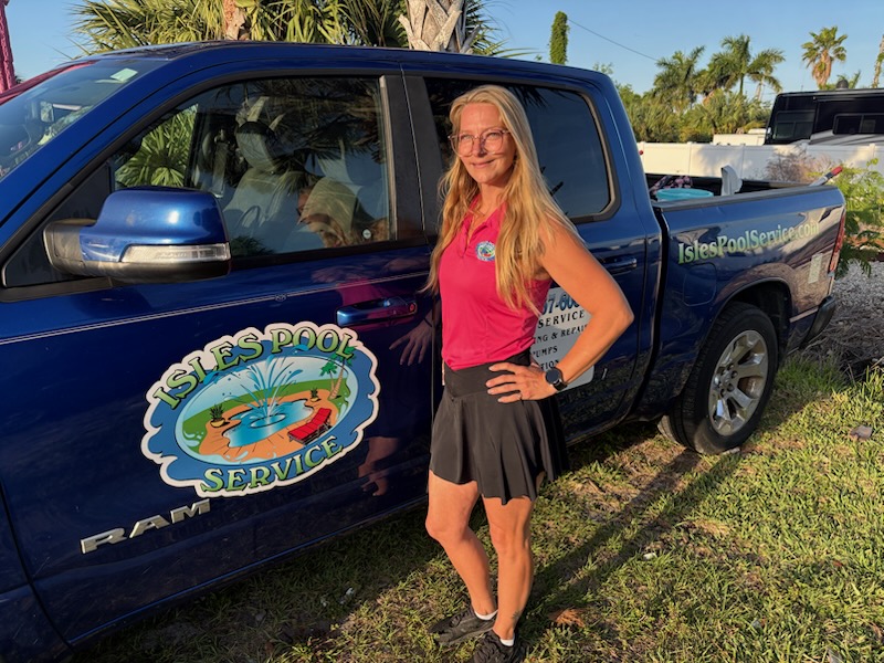 Luxury pool with blue LED underwater lighting and upscale patio landscaping